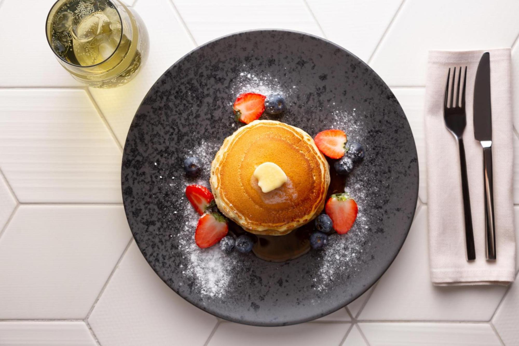Sheraton Astana Hotel Exterior photo A stack of pancakes with fruit
